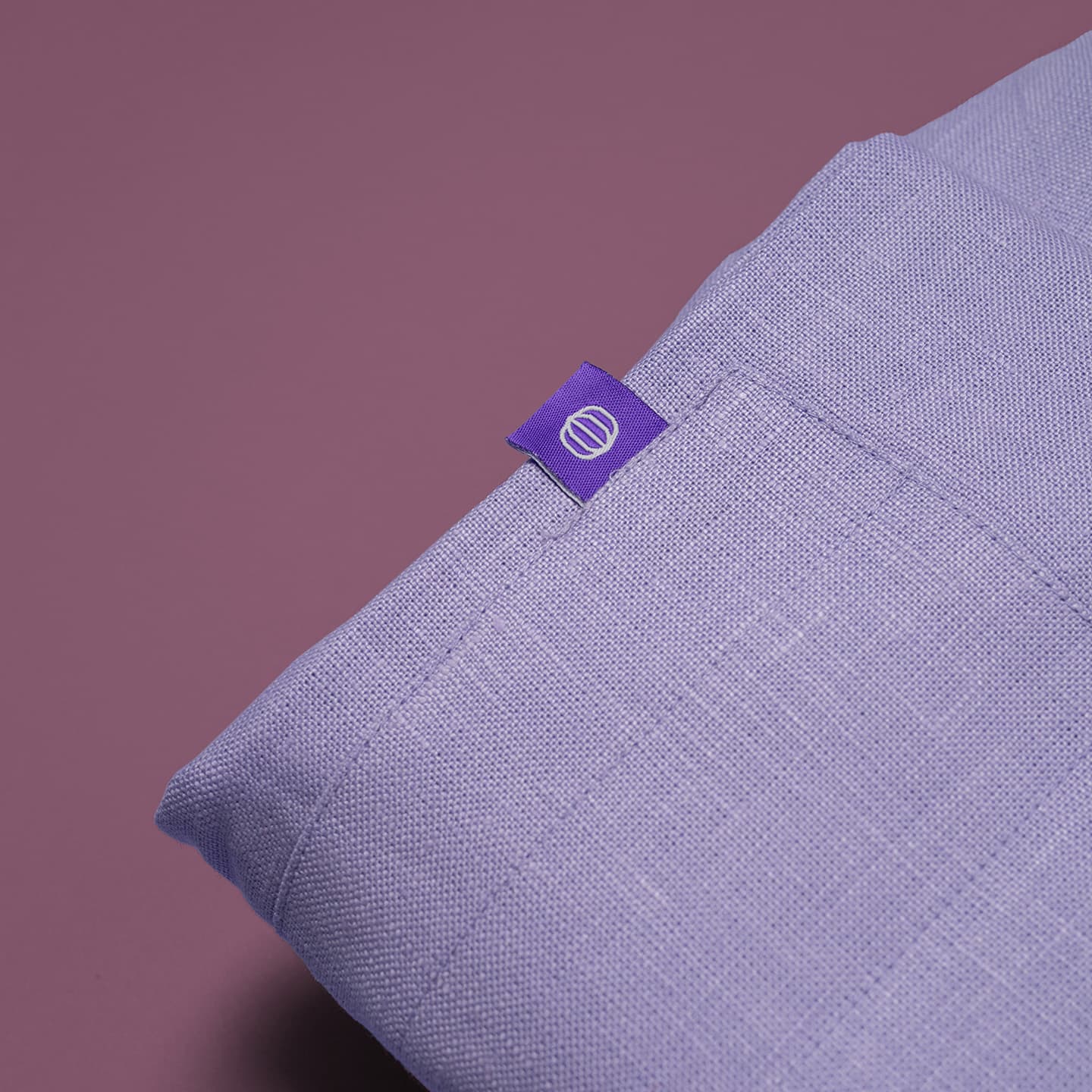 Apron detail shot: light purple color, tines tag